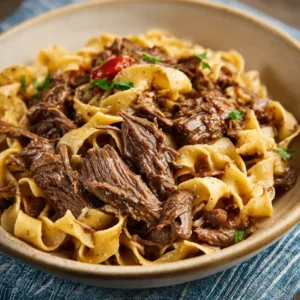 Slow cooker beef and noodles, ready to eat.