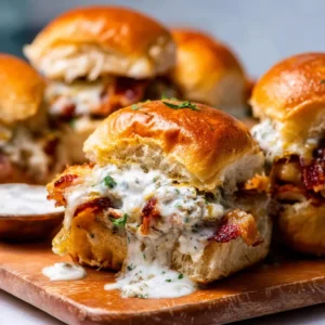 Chicken Bacon Ranch Sliders: Mini burgers with chicken, bacon, & ranch dressing.