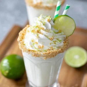 Key lime pie milkshake. Creamy, tart dessert in a glass.