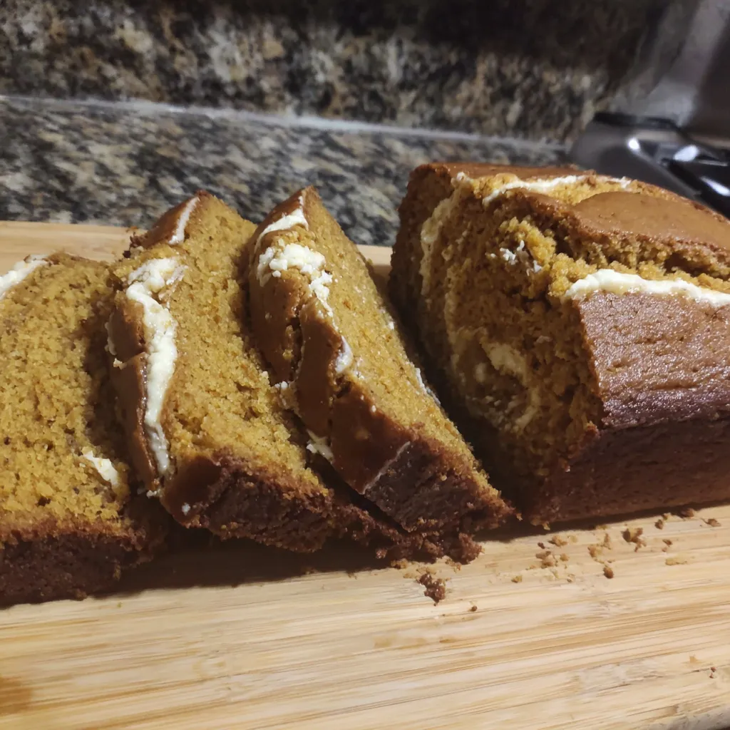 Pumpkin swirl bread loaf, sliced. Fall baking recipe.