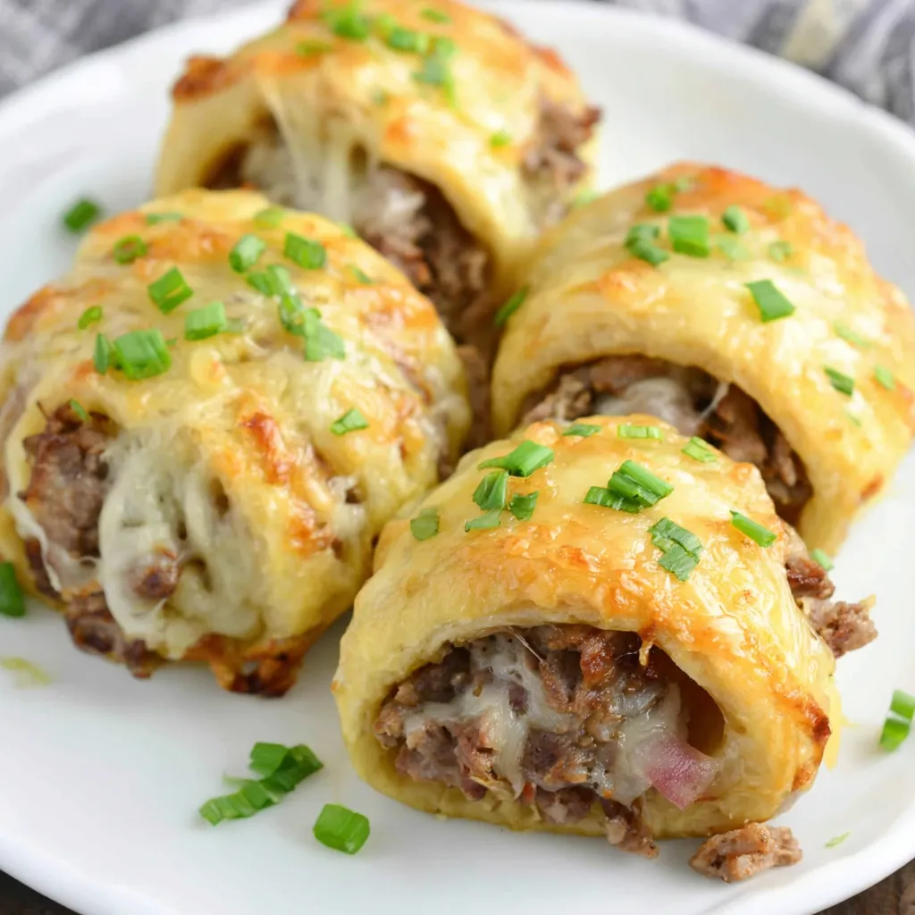 Keto Philly Cheesesteak Rolls Recipe Close-up of delicious Keto Philly Cheesesteak Rolls, showcasing the cheesy filling and toasted roll.