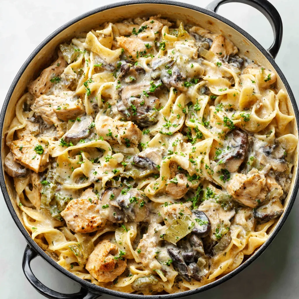 Close-up shot of creamy Chicken Stroganoff served in a bowl, showcasing its rich texture and delicious sauce.