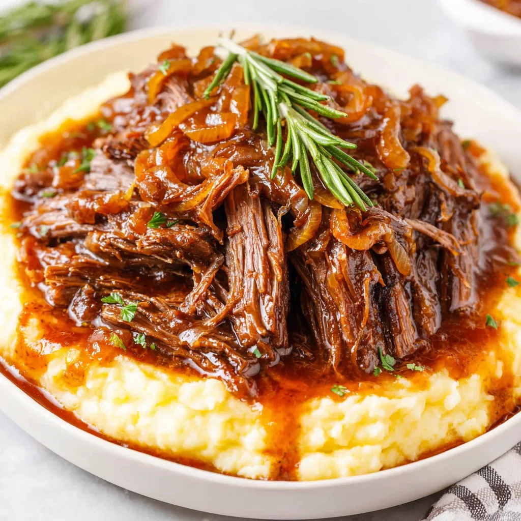 Close-up of delicious French Onion Pot Roast, showcasing the caramelized onions and tender beef.