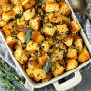 BEST HOMEMADE STUFFING RECIPE 2 Close-up of delicious Homemade Stuffing, showcasing its golden-brown crust and savory ingredients.