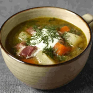 BEST POLISH POTATO SOUP 2 A bowl of creamy Polish Potato Soup is presented as a featured image for a recipe article.