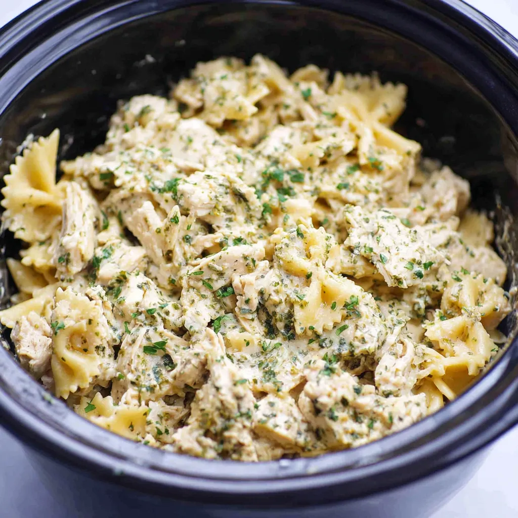 CROCKPOT GARLIC PARMESAN CHICKEN PASTA EASY 1 Crockpot Garlic Parmesan Chicken Pasta is a delicious and easy dinner shown in a tempting featured image.