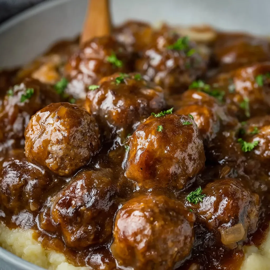 IRRESISTIBLE SLOW COOKER SALISBURY STEAK MEATBALLS 1 Slow Cooker Salisbury Steak Meatballs are showcased in a delicious-looking featured image, highlighting the hearty comfort food recipe.