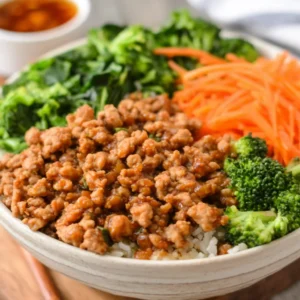 IRRESISTIBLE TERIYAKI GROUND CHICKEN BOWLS 2 Teriyaki Ground Chicken Bowls are beautifully presented in this enticing featured image.