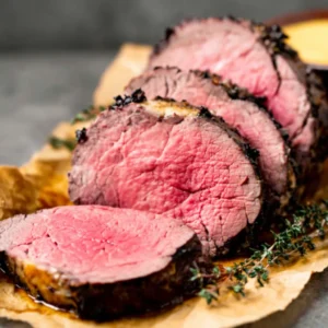PERFECT BEEF TENDERLOIN ROAST 2 A delectable Beef Tenderloin Roast is beautifully presented, ready to be sliced and served as a featured dish.