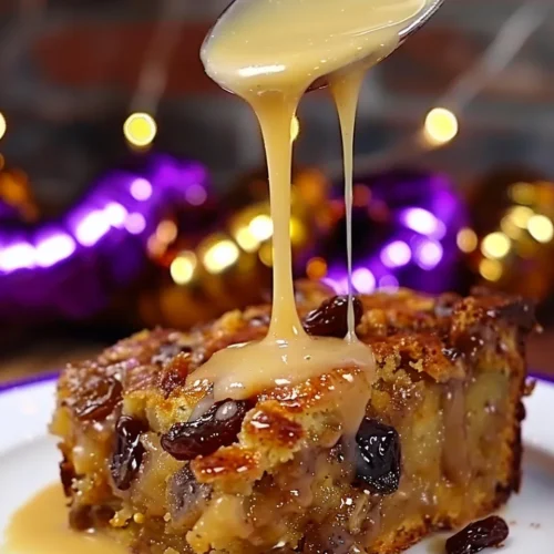 Bread Pudding with Bourbon Sauce 2 lina033321 Close up of a square slice of warm bread pudding o 38942b95 e04d 4c55 b3c9 83e92cdbc494 3 - Bread Pudding with Bourbon Sauce