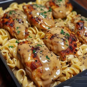 One-Pan Chicken with Buttered Noodles – Perfect for Busy Nights 3 lina033321 close up of pan seared chicken cutlets nestled ove bc20fe5c bf3f 4d4e a165 787bb7b9143b 3 - One-Pan Chicken with Buttered Noodles – Perfect for Busy Nights