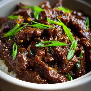 EASY SLOW COOKER MONGOLIAN BEEF 2 Delicious Mongolian Beef served as a featured image.