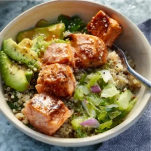 SALMON QUINOA BOWL EASY 2 A delicious Salmon Quinoa Bowl is displayed as the featured image for this healthy recipe.
