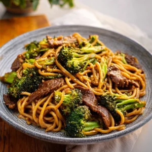 BEEF AND BROCCOLI LO MEIN BETTER TAKEOUT 2 Delicious Beef And Broccoli Lo Mein with tender beef, fresh broccoli, and savory noodles.